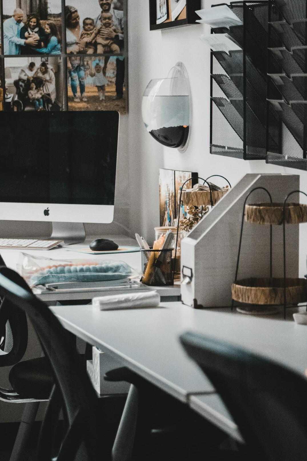 Bright modern office workspace with video editing monitors and a desk